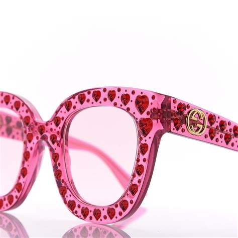 pink gucci sunglasses with rhinestones.